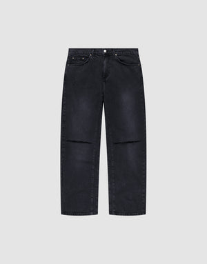 The LIVE FAST DIE YOUNG Oversize Ripped Denim features a black straight-leg, baggy fit with slight fading, five pockets, subtle knee distressing, and is made from 100% Baumwolle. Shown on a plain light gray background. | plain