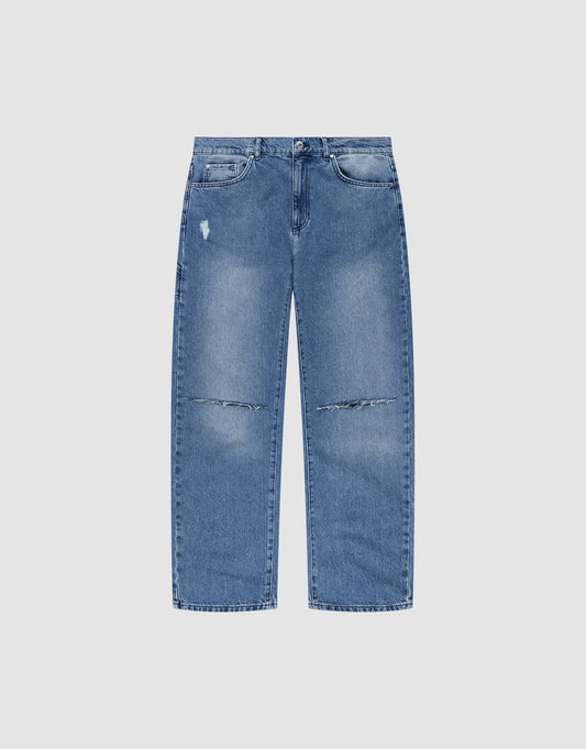 The LIVE FAST DIE YOUNG Oversize Ripped Denim jeans feature a light blue wash, straight-leg fit, distressed details with a rip above one pocket, faded knee patches, five pockets, a button fly, and classic Gerades Bein style. | plain