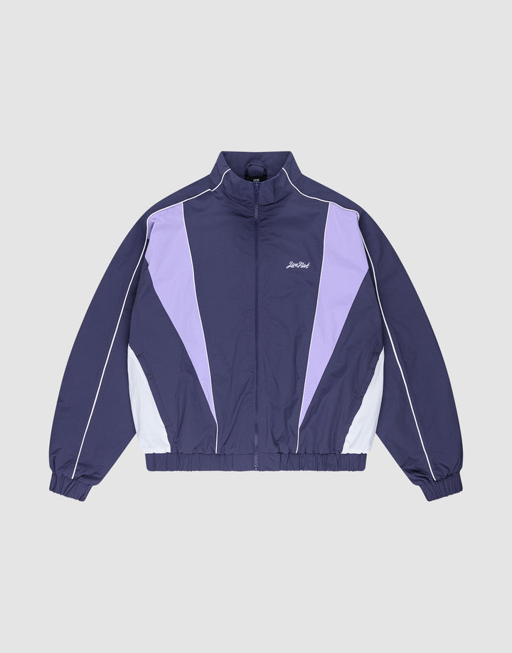 The LIVE FAST DIE YOUNG Basic Nylon Trackjacket features a navy blue and lavender Regular Fit with white accents, a zip-up front, high collar, Logo-Stick detail, and elastic cuffs and hem, shown on a light gray background. | plain