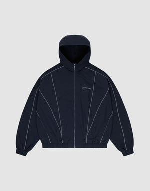 The LIVE FAST DIE YOUNG Live Fast Trackjacket, a navy blue nylon regular fit jacket with front zipper, elastic cuffs and hem, white piping, and reflective "LIPHOP" on the left chest, is displayed flat on a light gray background. | plain