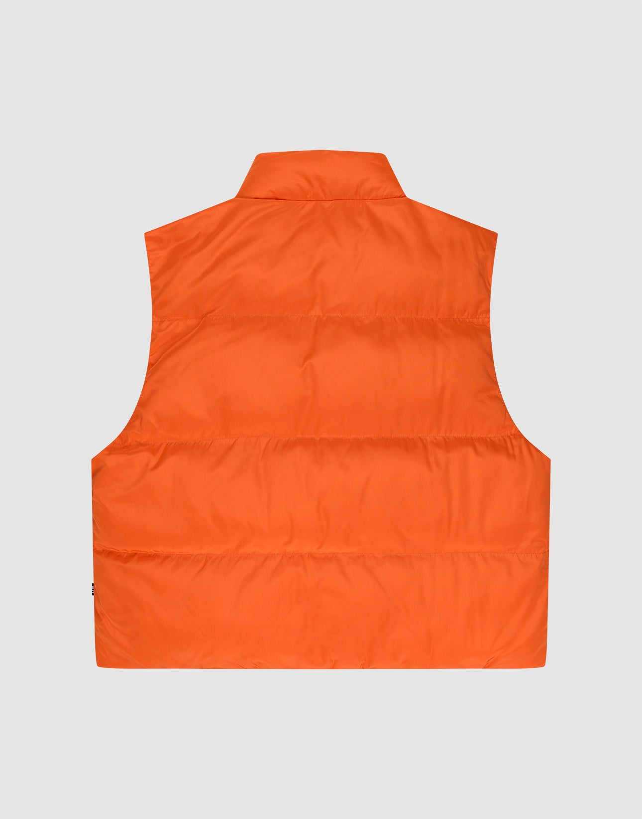 The Live Fast Cropped Vest by LIVE FAST DIE YOUNG is shown from the back in bright orange with horizontal quilting and a high collar, set against a plain light gray background.