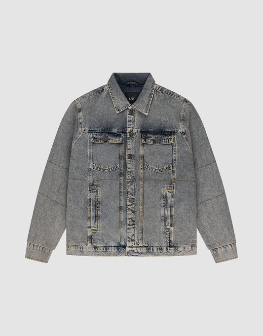 The LIVE FAST DIE YOUNG Puffed Denim Coach Jacket in light blue features an oversized fit, button-up front, vintage wash, two chest flap pockets, and two side pockets, shown against a plain light gray background. | plain