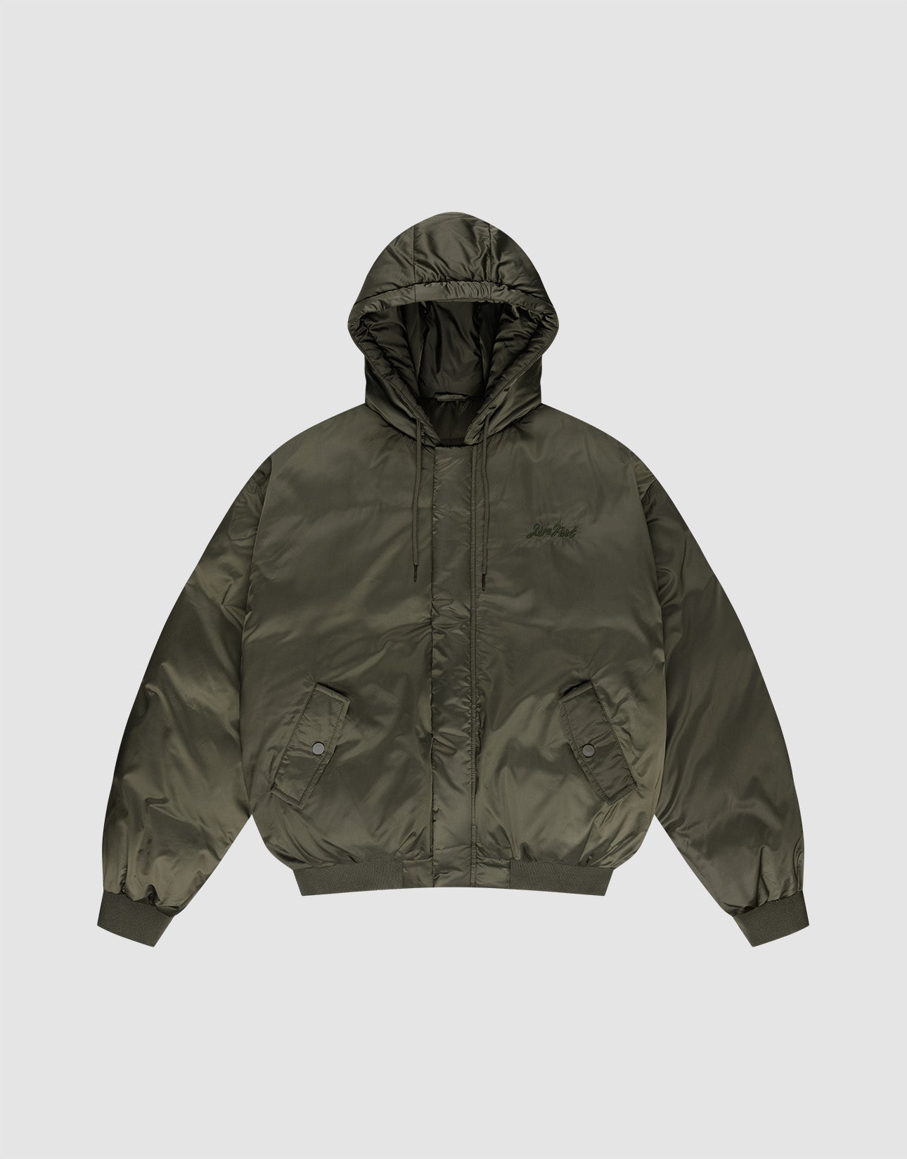 The LFDY Winter Bomber Jacket by LIVE FAST DIE YOUNG features an olive green oversize fit, hood with drawstrings, front snap pockets, ribbed cuffs and hem, and a subtle chest logo stick, shown on a plain light gray background.