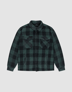 The LIVE FAST DIE YOUNG Heavy Flannel Shacket features green and black plaid, Vintage-Effekt finish, button-down front, flap chest pockets, and side pockets, shown laid flat on a plain light gray background. | plain