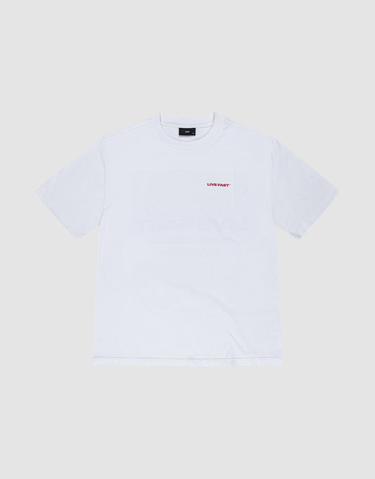 The LFDY Cinema Tee by LIVE FAST DIE YOUNG is an oversized white short-sleeve shirt made from 100% Baumwolle, featuring small red 'LIVE FAST' text on the left chest, shown against a light gray background.
