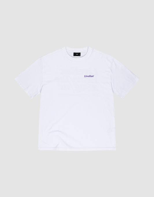 The LIVE FAST DIE YOUNG Basic 280 Tee, an oversize fit white cotton short-sleeve shirt, is laid flat on a light gray background and features a small purple LiveFast logo printed on the left chest.