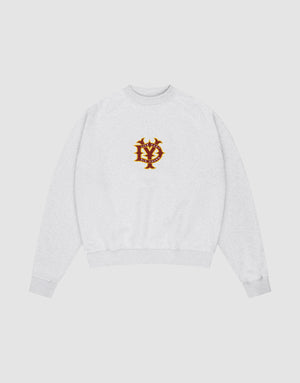The DY Sweater by LIVE FAST DIE YOUNG is a light gray oversize fit crewneck with ribbed cuffs and hem, raglan sleeves, and a red and gold embroidered NY emblem on the chest, shown on a plain white background. | plain 