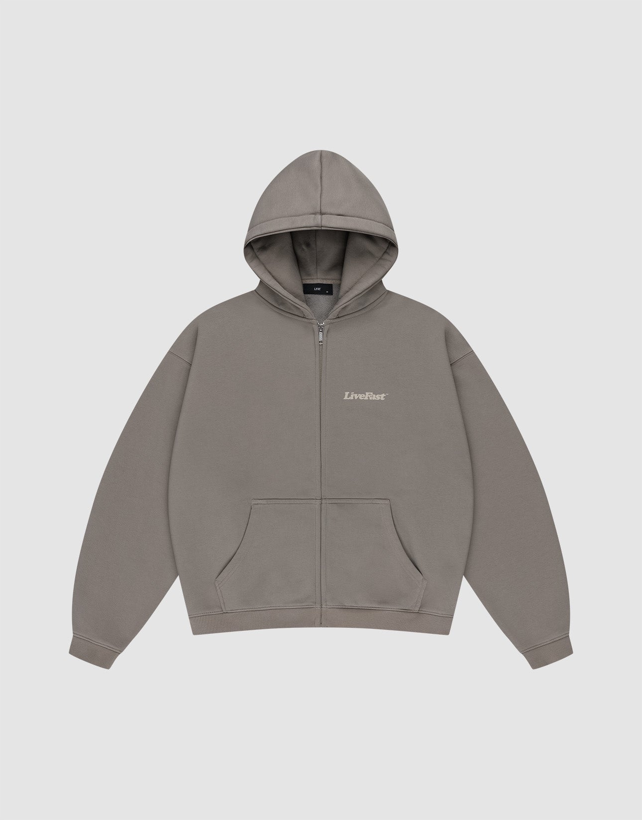 The Basic 510 Hooded Zip by LIVE FAST DIE YOUNG is a plain grey zip-up hoodie with a subtle vintage wash, front pockets, hood, and "LiveFast" in small white text on the left chest, shown flat on a light grey background.