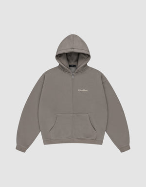 The Basic 510 Hooded Zip by LIVE FAST DIE YOUNG is a plain grey zip-up hoodie with a subtle vintage wash, front pockets, hood, and "LiveFast" in small white text on the left chest, shown flat on a light grey background.| plain