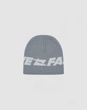 The Live Fast Jacquard Beanie by LIVE FAST DIE YOUNG is a soft gray polyacryl knit with a bold white Logo Strick graphic and partially visible text on the front. Model: LF2410-16486.
