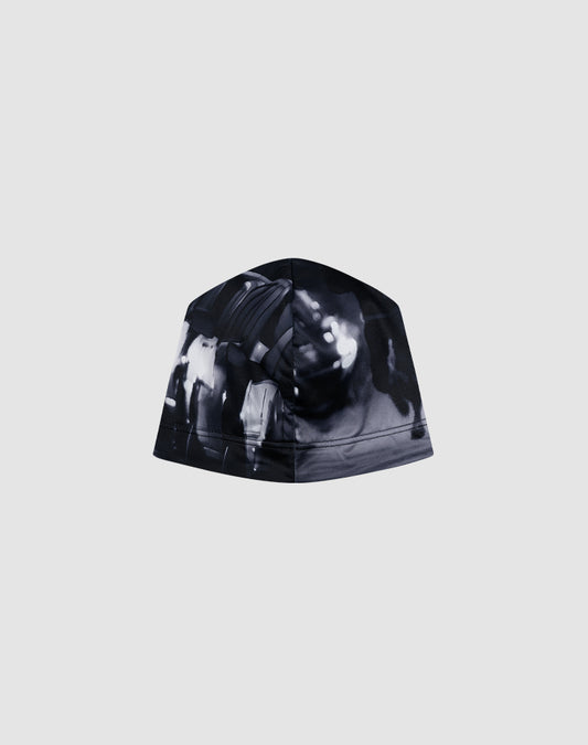The LIVE FAST DIE YOUNG Live Fast Performance Beanie features a black and white abstract, blurred graphic print on a plain grey background.