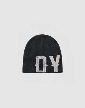 The DY Waffle Beanie by LIVE FAST DIE YOUNG is a black knit beanie with bold white DY lettering and a handgefertigter Sprayeffekt, shown on a plain light gray background.
