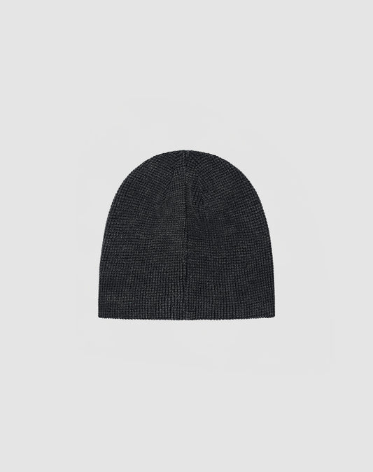 The DY Waffle Beanie by LIVE FAST DIE YOUNG in plain dark gray, made from 100% cotton, features a handcrafted spray effect for a unique look, shown against a light gray background.