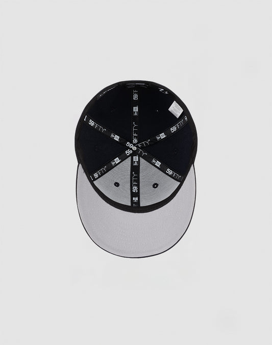 A top-down view of the LFDY x NEW ERA 59FIFTY Low Profile Fitted Cap by LIVE FAST DIE YOUNG, featuring black seams, a black crown, and a gray brim against a plain light background.