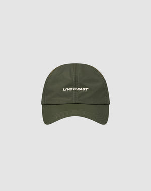 The LFDY Performance Cap by LIVE FAST DIE YOUNG is an olive green nylon cap with white LIVE FAST text on the front, geometric ventilation holes, and adjustable sizing, shown on a light gray background.