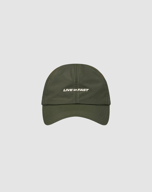 The LFDY Performance Cap by LIVE FAST DIE YOUNG is an olive green nylon cap with white LIVE FAST text on the front, geometric ventilation holes, and adjustable sizing, shown on a light gray background.