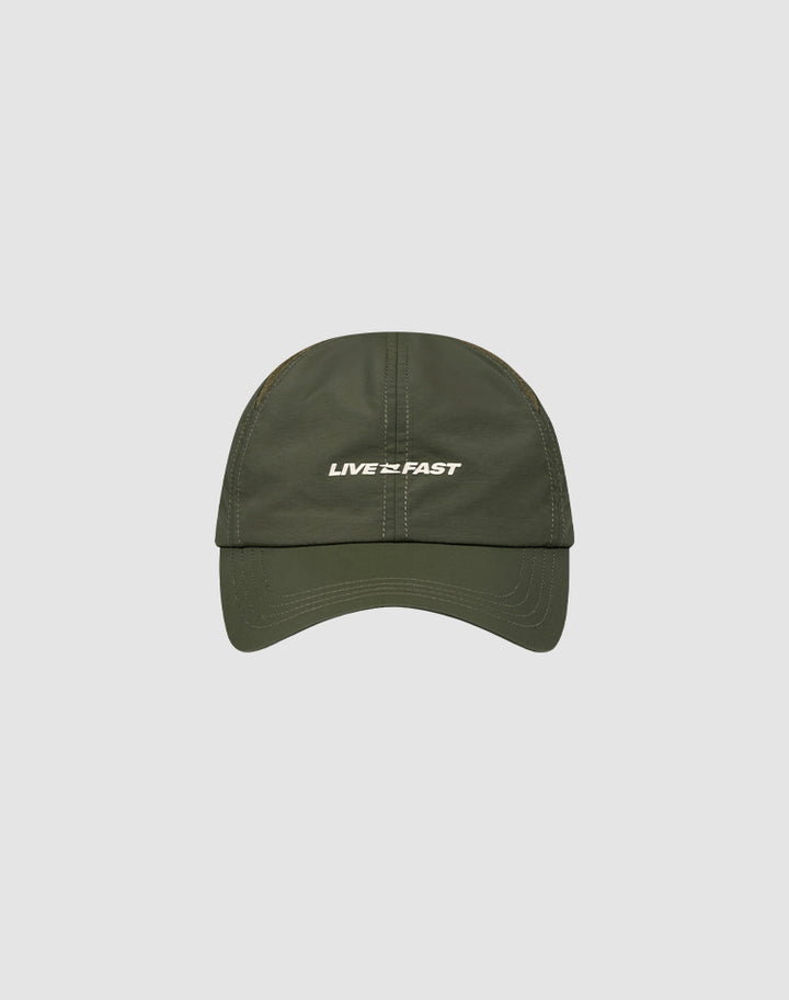 The LFDY Performance Cap by LIVE FAST DIE YOUNG is an olive green nylon cap with white LIVE FAST text on the front, geometric ventilation holes, and adjustable sizing, shown on a light gray background.