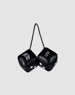Two black LFDY Leather Car Dice by LIVE FAST DIE YOUNG, connected by a black string, hang from your rearview mirror. Both display "LEFTY" with white dots and lettering against a plain light gray background.