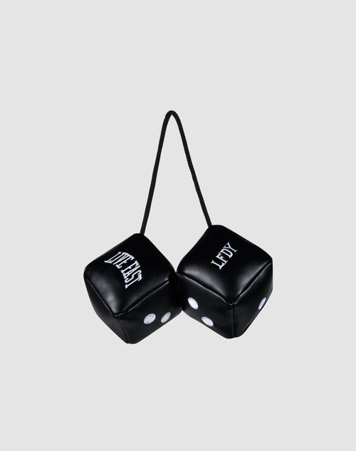 Two black LFDY Leather Car Dice by LIVE FAST DIE YOUNG, connected by a black string, hang from your rearview mirror. Both display "LEFTY" with white dots and lettering against a plain light gray background.