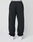 A person models the LIVE FAST DIE YOUNG Basic Loose Jogger in black, featuring an elastic waistband and subtle logo print, paired with white sneakers. The shot is from the back, focusing on the lower body against a plain background.