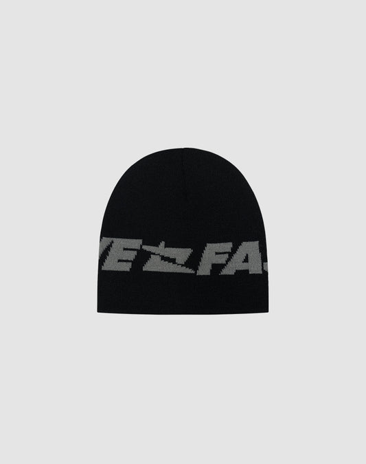 The Live Fast Jacquard Beanie by LIVE FAST DIE YOUNG is black with a bold gray Logo Strick text wrapping the lower edge, made from soft Polyacryl. Shown on a plain light gray background. Model: LF2504-17542.