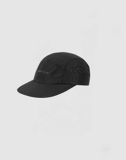 The Live Fast 5 Panel Cap by LIVE FAST DIE YOUNG features a black nylon build, silicone LIVE FAST print on the front, and perforated side panels for breathability, shown against a plain white background.