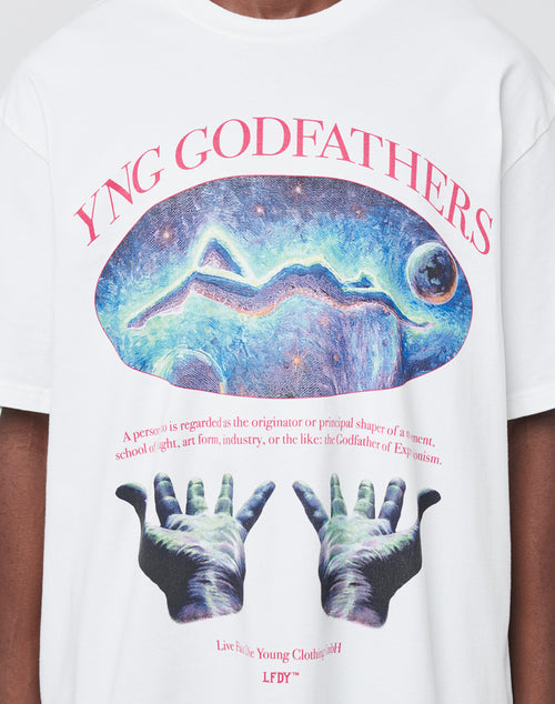 The YNG Godfathers Tee by LIVE FAST DIE YOUNG is a white, 100% cotton, oversized shirt with YNG GODFATHERS above cosmic art and uplifted hands. Below is a godfather definition and Live Fast Young Clothing in red. Vintage effect finish.