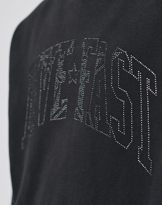 Close-up of the black Live Fast Rhinestone Hooded by LIVE FAST DIE YOUNG, featuring an oversize fit and LIVE FAST in large outlined letters with star designs.