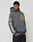 A man wears a dark gray LFDY Department Hooded by LIVE FAST DIE YOUNG with a large yellow Siebdruck front print, a sleeve patch, and bold white LFDM lettering down the other sleeve, hands in pockets and looking down.