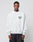 A man faces forward wearing the LIVE FAST DIE YOUNG Live Fast Die Young Chest Sweater, a light gray, oversized top with vintage effect and a small roaring tiger graphic plus Live Fast Die Young text on the left chest, paired with dark jeans.