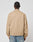 A person stands with their back to the camera, wearing the LIVE FAST DIE YOUNG Live Fast Twill Jacket—light brown, regular fit with Hemdkragen, elastic cuffs and hem—and light blue jeans, set against a plain white background.