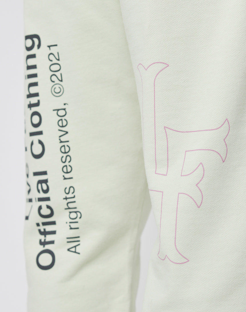 Close-up of light-colored 100% Baumwolle fabric from the LFDY Official Jogger featuring black vertical text "Official Clothing All rights reserved, ©2021" and a large outlined pink F on the right; print on front and back.