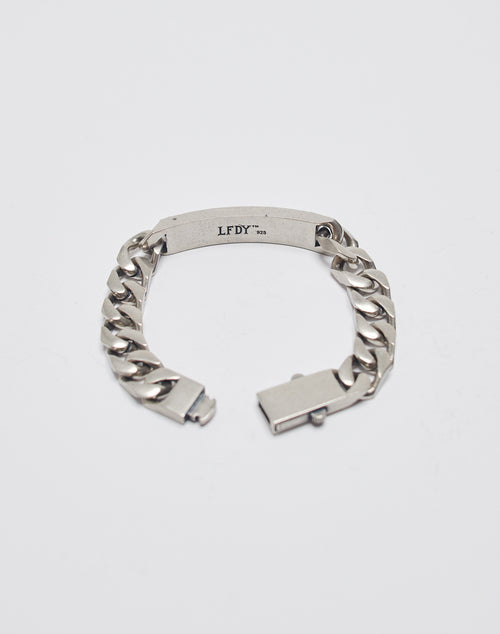 The New World Order Bracelet by LIVE FAST DIE YOUNG features chunky 925 sterling silver links and a rectangular LFDY 925-engraved plate, shown with its unclasped closure on a white background.