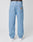 Person in light blue, loose Wide Denim jeans by LFDY, seen from the back. Features two back pockets and a brown LFDY patch. White sneakers and a black waistband with LEXY text complete this true-to-size look.