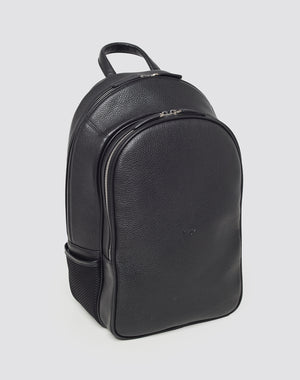 The LFDY Leather Backpack by LIVE FAST DIE YOUNG, featuring black Rindsleder, silver zippers, front and side pockets, a top handle, and a Laptop Fach, stands upright against a plain light background.