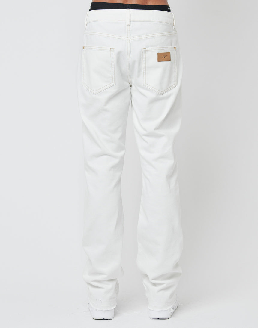 A person faces away wearing LFDY Striped Flared Denim with visible back pockets and a tan leather patch on the waistband; background is plain white.