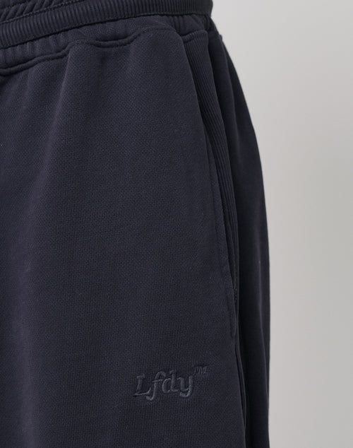Close-up of the side pocket on dark navy Wide Jogger 2.0 by LFDY, featuring tone-on-tone LFDY embroidery. The ribbed waistband and soft, textured cotton provide a comfortable, relaxed style.