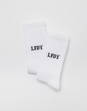 The LFDY Logo Socks (2 Pack) by LFDY are shown side by side on a plain white background. Both socks feature LFDY printed in bold black uppercase letters near the top and are made from a soft Baumwolle-Elastan-Polyamid blend.